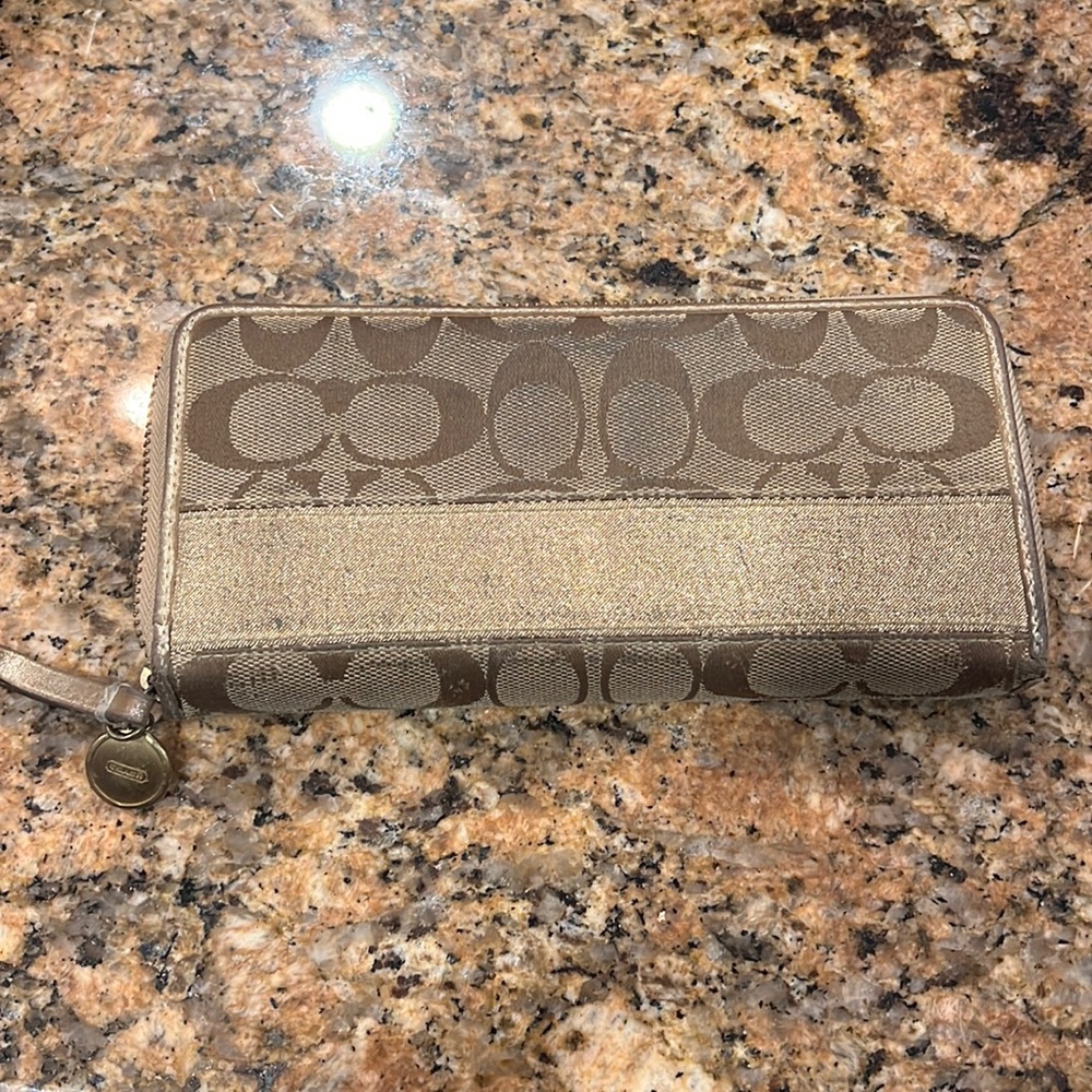 Tan and gold coach wallet